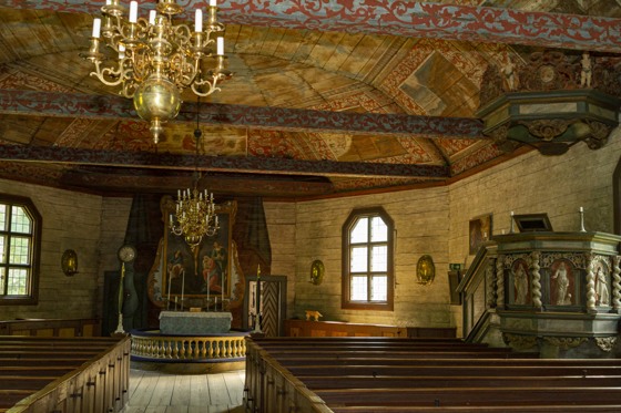 Seglora church with chandeliers hanging from the ceiling